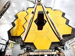 Engineers working on the Optical Telescope Element or mirrors of the James Webb Space Telescope.