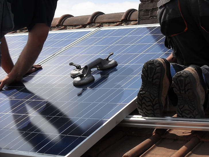 Solar panels being installed on a military base.
