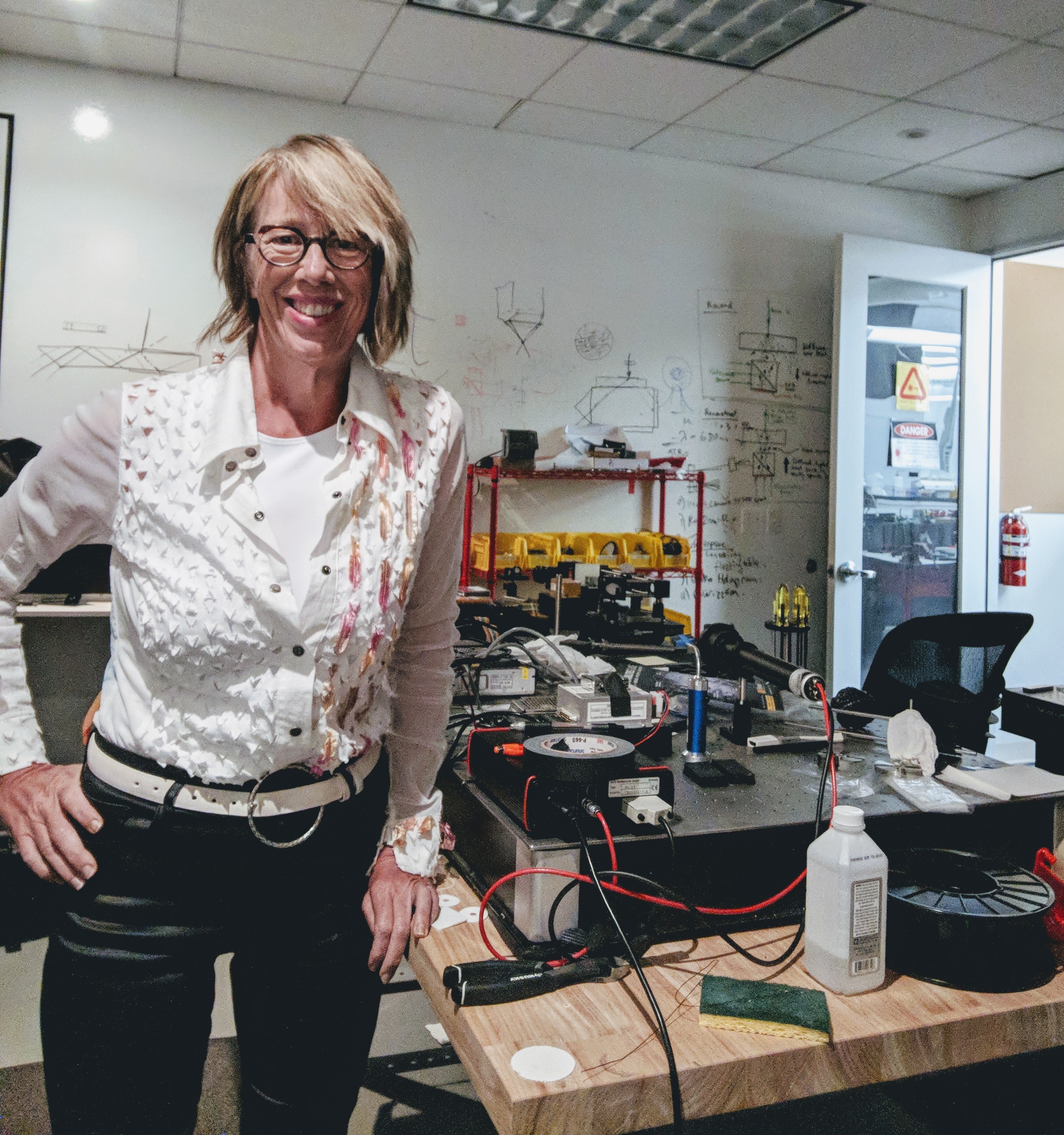 Mary Lou Jepsen working on an optical system in her laboratory.