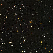 Image taken by the Advanced Camera for Surveys (ACS) on the Hubble Space Telescope. It is is the further image taken possible in the visual spectrum. It is black with gold and silver lights scattered throughout