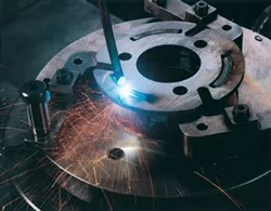 A laser welding a piece of metal. 