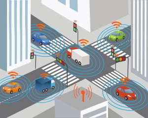 Motor vehicles traveling through an intersection where all are communicating with the traffic signal, wirelessly. 