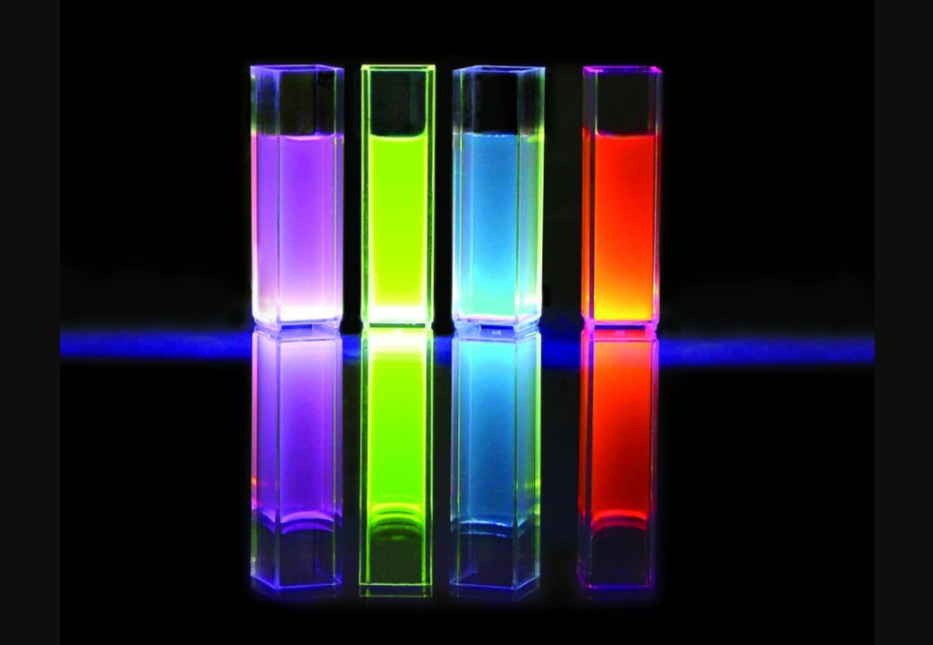 Image of various dye solutions in cuvettes, each displaying a distinct color, representing different types of laser dyes.