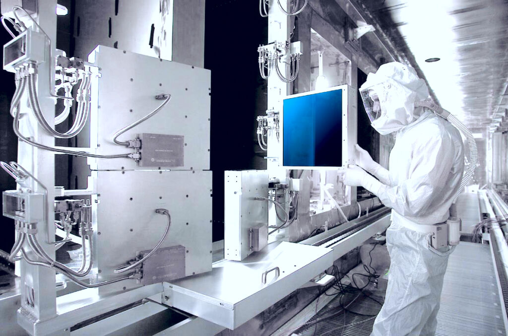 Calorimeters: Engineer in a white clean-room suit adjusting a laser calorimeter for high power and energy measurements.