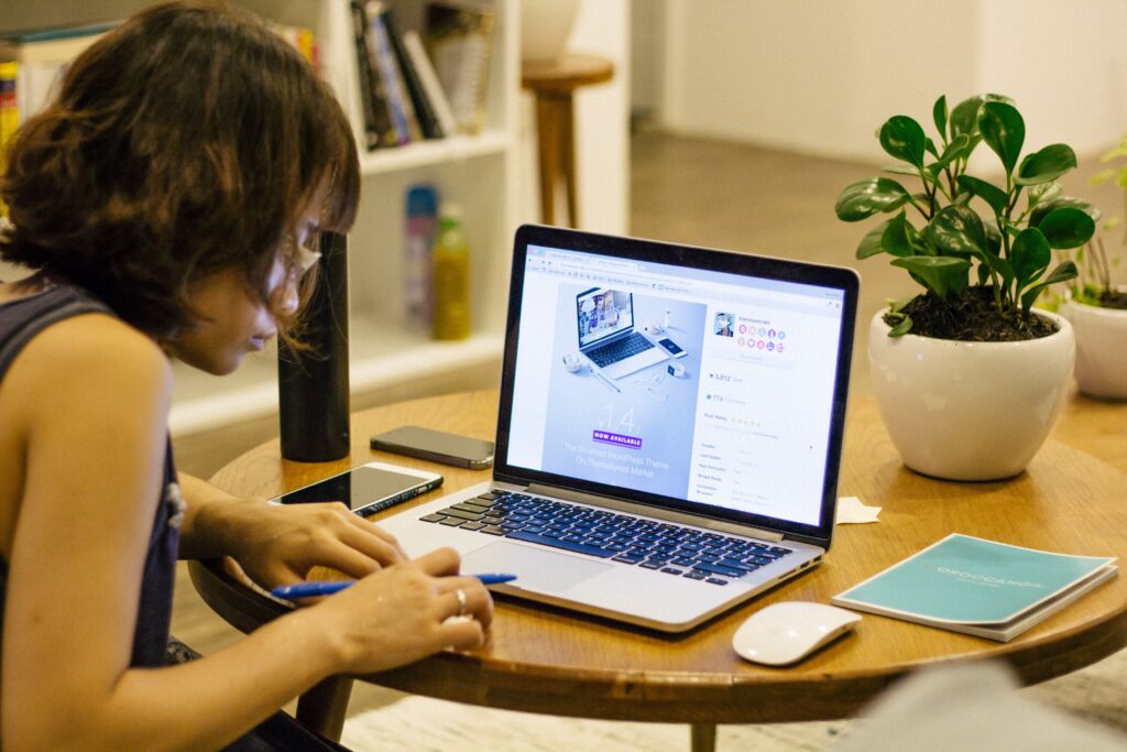 Traveling Sales Tips: Saleswoman working on laptop in a travel setting.